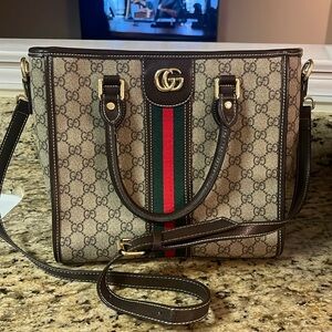 Leather bag and crossbody strap. 12 by 10